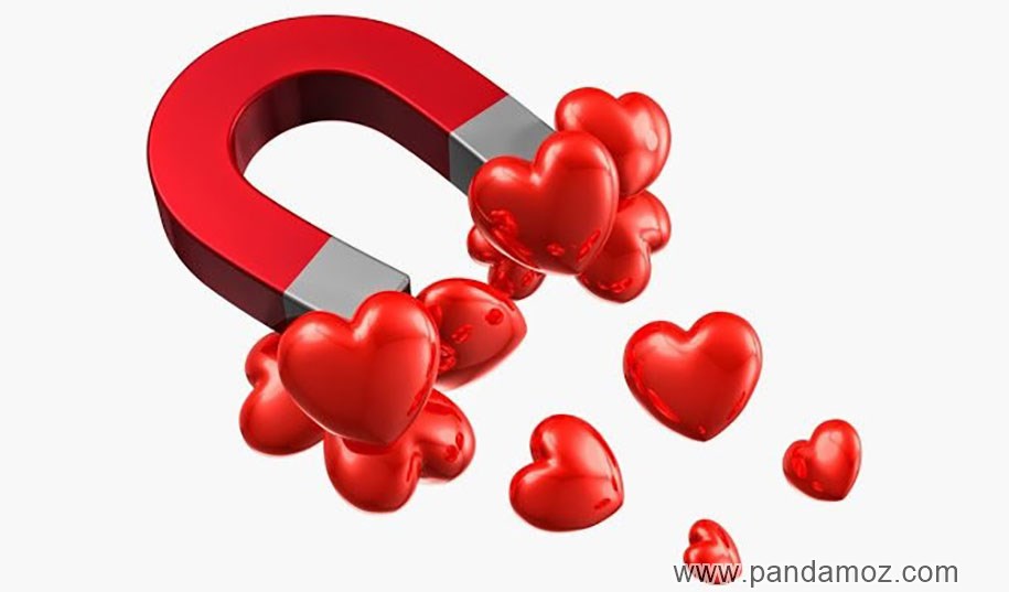 عکس نقاشی آهنربای نعلی شکل که قلب های قرمز رنگ را به خود جذب کرده نشانه جذب قلب های دیگران با آهن ربای محبت درون خویش